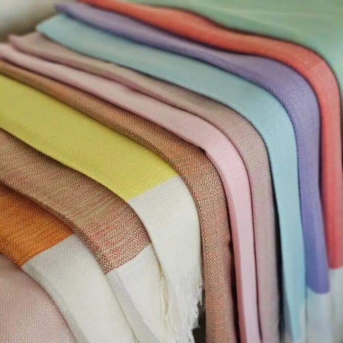 Color variety of Lomyna LOVE towels arranged in multiple shades.