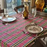 Close-up of a dining table setting placed on a red Lomyna LOSA collection