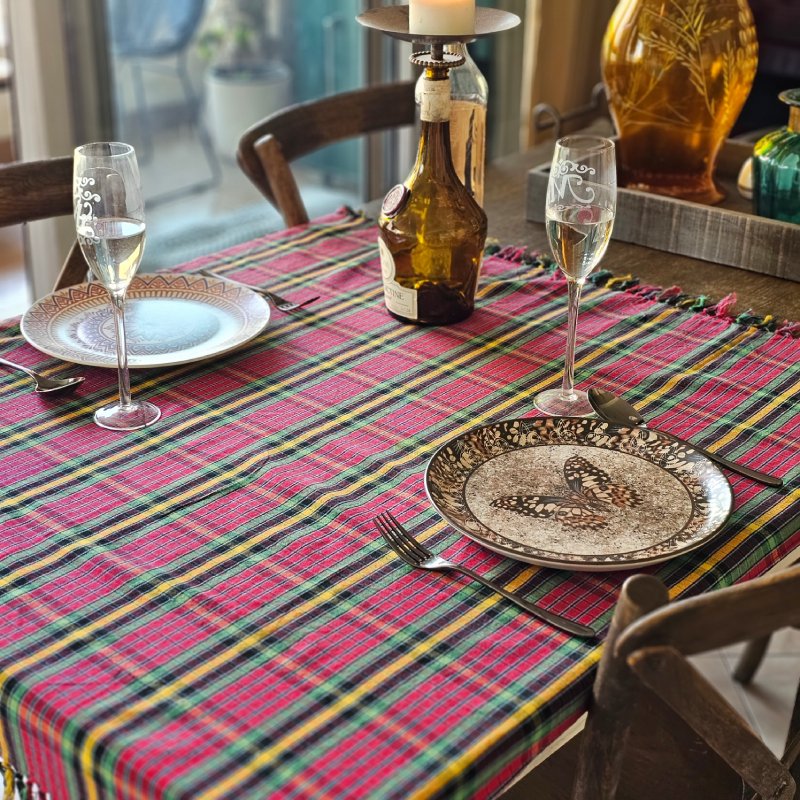 LOSA – Dining Detail Close-up of a dining table setting placed on a red Lomyna LOSA collection